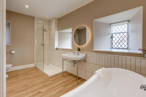 a bathroom with a tub and a sink and a shower at 2 Bed in Ludlow oc-p31882 in Ludlow