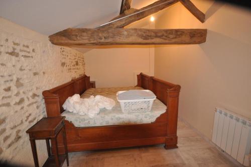 a small bedroom with a bed in an attic at Chez Gérard in Saint-Martin-Lars-en-Sainte-Hermine