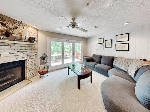 a living room with a couch and a fireplace at Deep Creek Village #33 in McHenry