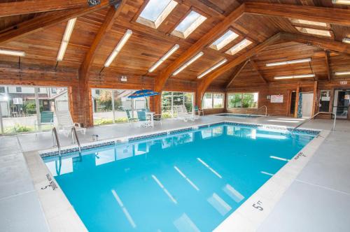a large swimming pool with a wooden ceiling at Ski Harbor 14 in McHenry