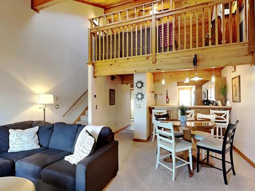 a living room with a couch and a table at Sunplace 02 in McHenry