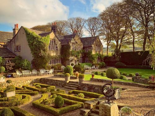 a house with a garden in front of it at Holdsworth House Hotel in Halifax