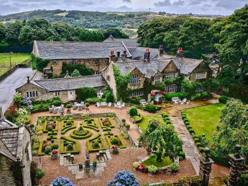 an aerial view of a house with a garden at Holdsworth House Hotel in Halifax