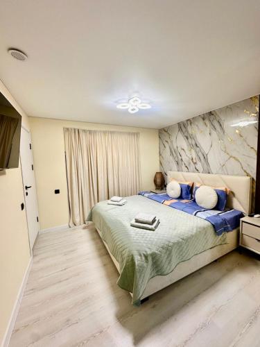 Llit o llits en una habitació de ERA Studios Chisinau