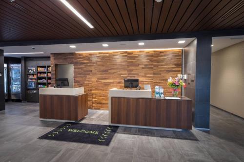 a lobby of a salon with a reception desk at Courtyard by Marriott Russellville in Russellville