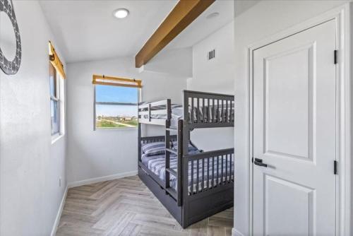 a room with two bunk beds and a door at 6 Bedroom, 3 unit Triplex in Crystal Beach in Port Bolivar