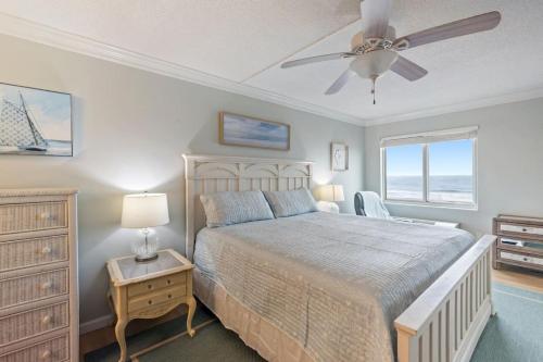 a bedroom with a bed and a ceiling fan at Oceanfront Condo, Heated Pool, Fitness Center in Virginia Beach