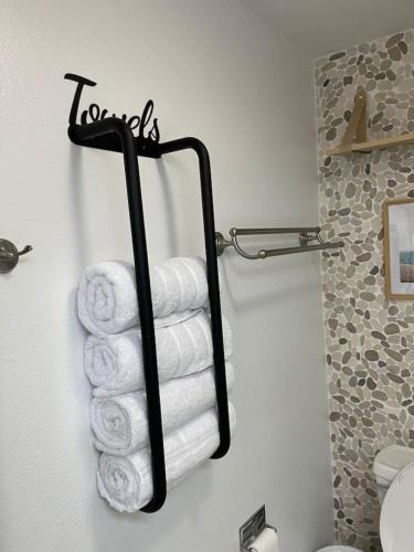 a towel rack with towels in a bathroom at The Wanderlust at the Sunset Cove in Wisconsin Dells