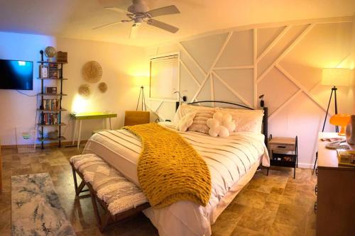 a bedroom with a bed with a teddy bear on it at The Wanderlust at the Sunset Cove in Wisconsin Dells