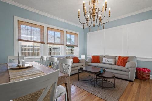 a living room with a couch and a table at The Anchor Once Upon A Tide Villas POOL in Bay Saint Louis