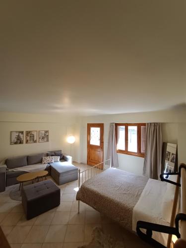 a living room with two beds and a couch at Nafplio Nook 2 in Nafplio