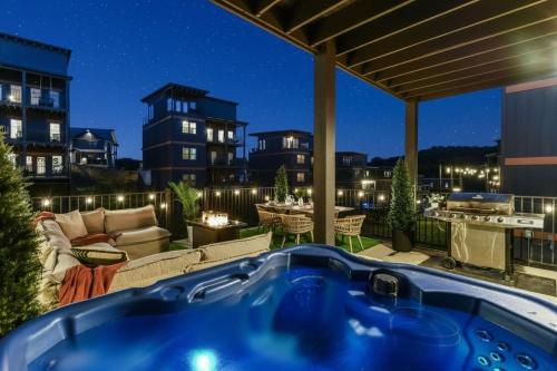 a hot tub on a patio at night at Smith Creek Resort - 5 Bedrooms 20 Guest - Indoor Pool - Resort Amenities in Pigeon Forge