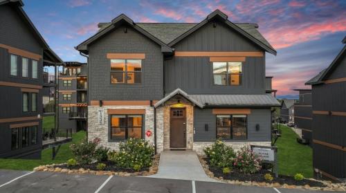 a home with a gray house at Smith Creek Resort - 5 Bedrooms 20 Guest - Indoor Pool - Resort Amenities in Pigeon Forge