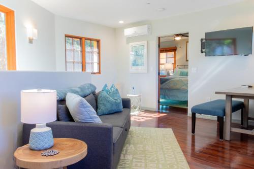a living room with a couch and a table at The Little Pumpkin Guest House in San Diego