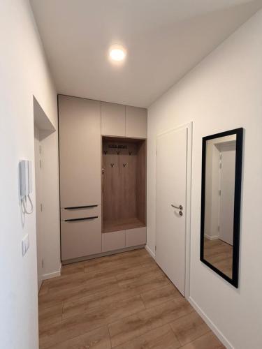 an empty room with a closet and a mirror at Sekvoja view apartment in Nová Baňa
