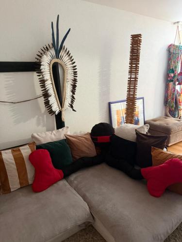 a couch with pillows on it in a living room at Zurich Apartment I Central Loft in Zurich