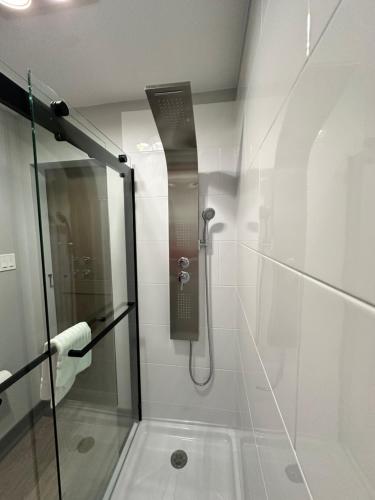 a shower with a glass door in a bathroom at Ponderosa Lodge Ascend Collection in Red River