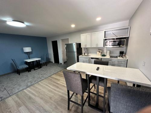 a kitchen with a table and chairs in a room at Ponderosa Lodge Ascend Collection in Red River