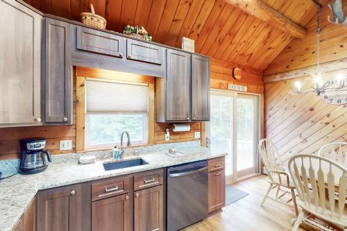 a kitchen with wooden walls and a wooden ceiling at Wooded Family Retreat! 11 Mi to Acadia Entrance in Trenton
