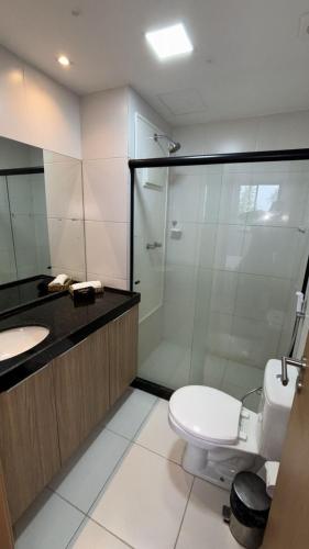 a bathroom with a shower and a toilet and a sink at Mana Experience Muro Alto in Porto De Galinhas
