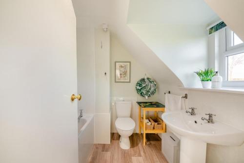 a white bathroom with a sink and a toilet at 2 Bed in Duns oc-c34024 in Duns