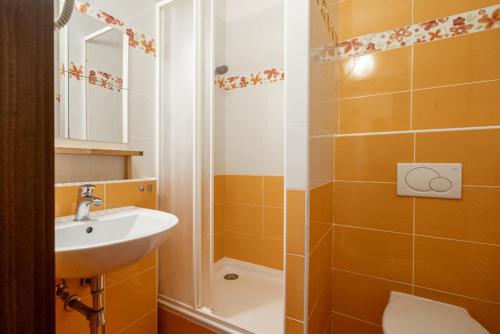a bathroom with a sink and a shower at Donovaly Kamzík in Donovaly