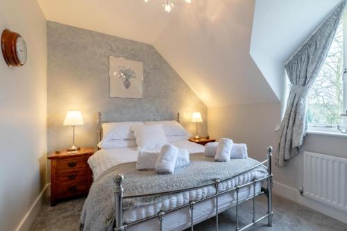 a bedroom with a bed with towels on it at 2 Bed in Beadnell oc-gd0376 in Beadnell