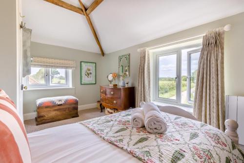 a bedroom with a bed with towels on it at 2 Bed in Tunstead oc-o32203 in Tunstead