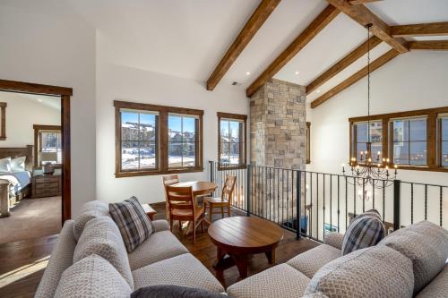 a living room with a couch and a table at The Porches in Steamboat Springs