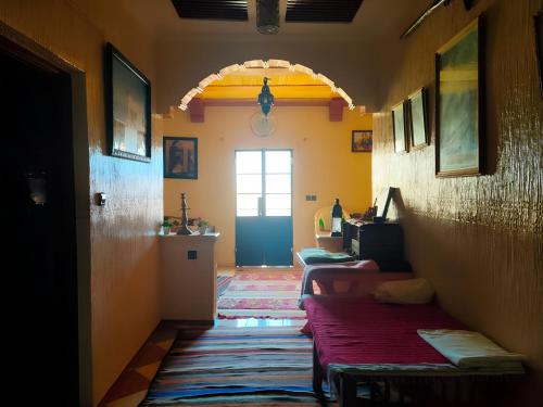 a hallway with two beds in a room at Guest house wakrim in Tafraout