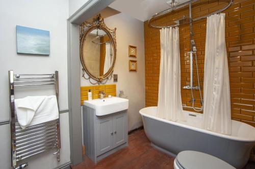 a bathroom with a tub and a sink and a mirror at 2 Bed in Bath oc-bhr35 in Bath