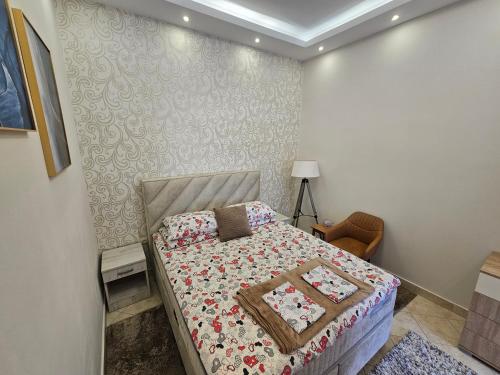 a bedroom with a bed in a room at Apartmani Vlaovic in Herceg-Novi