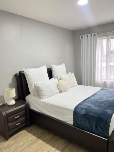 a bedroom with a bed with a stuffed animal on it at Luxury Property in Kingsborough