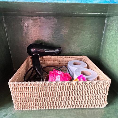 a basket with a phone and other items in it at Latidos del Centro de CDMX in Mexico City