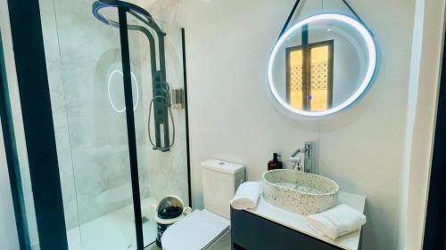 a bathroom with a shower and a toilet and a sink at B's House in Pointe-à-Pitre