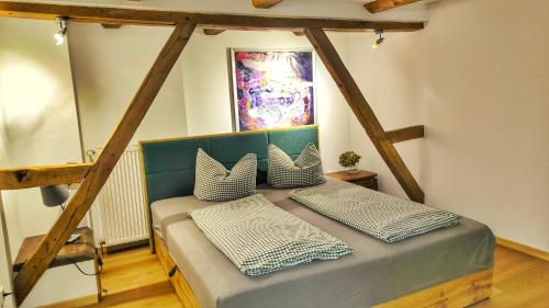 a bed with two pillows on it in a room at bei GRETA Wohnung 77 in Marl