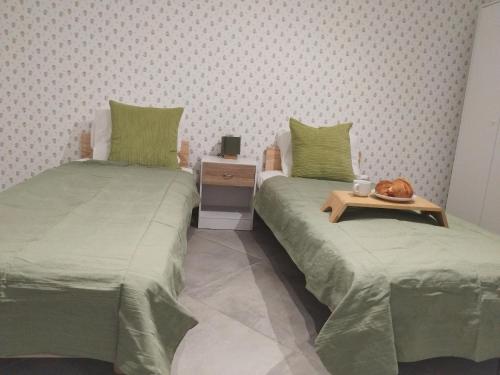 two beds sitting next to each other in a room at Iglu in Villeneuve-le-Roi