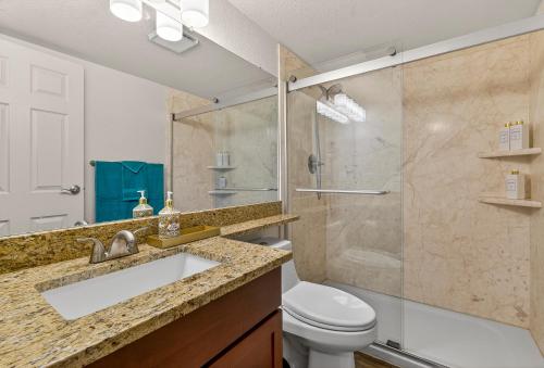 a bathroom with a shower and a sink and a toilet at Cowboy Hideout in Sedona