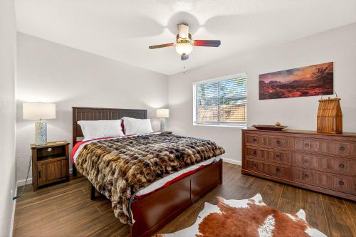 a bedroom with a bed and a ceiling fan at Cowboy Hideout in Sedona