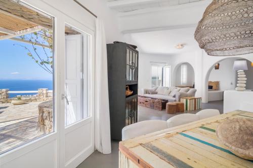 a living room with a view of the ocean at Boutique Villa Aquata Private pool in Mikonos