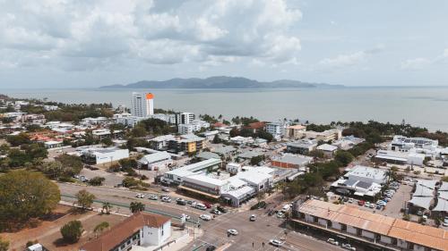 an aerial view of a city next to the water at Hotel Allen in Townsville