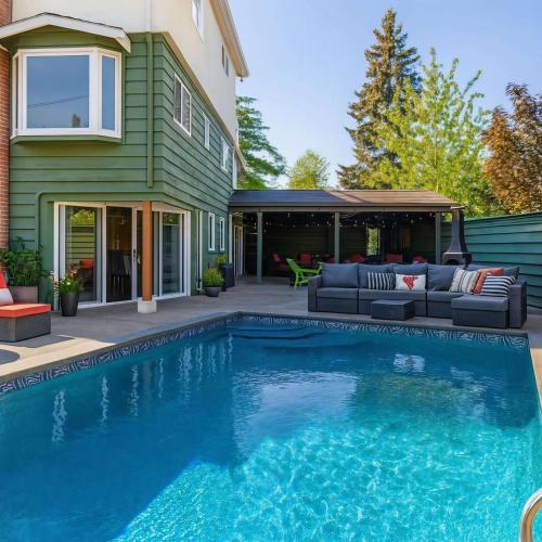 a swimming pool in front of a house at Hidden Oasis in Victoria, BC in Victoria
