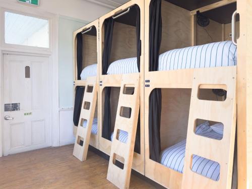 a group of bunk beds in a room at The Fenway in Launceston