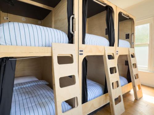 a bunk bed with four bunk beds in a room at The Fenway in Launceston