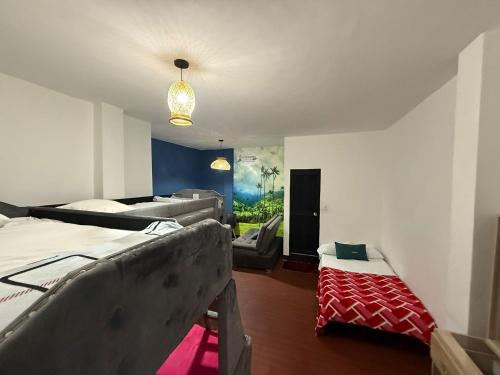 Llit o llits en una habitació de Hotel Ricocampo