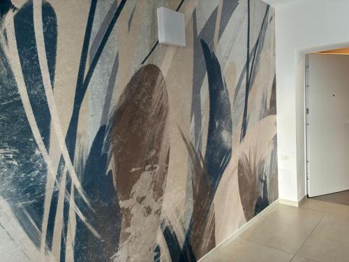 a painting on a wall in a room at Matilde Apartments Caorle in Caorle
