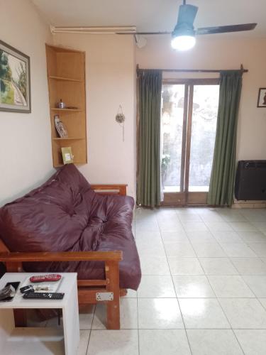 a living room with a couch and a table at Laura in Rosario
