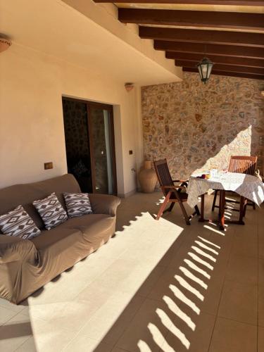 a living room with a couch and a table at Pollensa apartament in Pollença