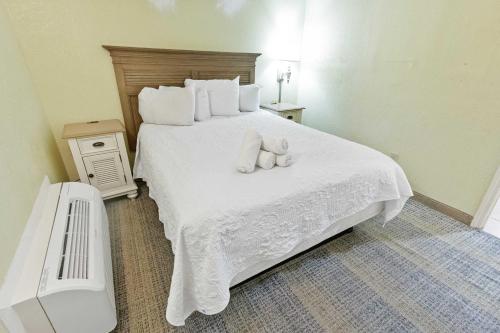 a bedroom with two stuffed animals on a bed at New Oceanview, Low Floor, Heated Pools! in Myrtle Beach