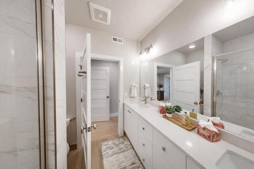 a white bathroom with a sink and a shower at Helling 203 in Heber City